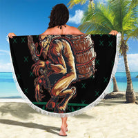 Round green beach blanket with fringe edge, large Krampus illustration with barrel on beach