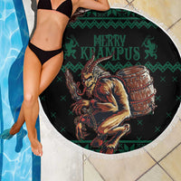 Round green beach blanket with fringe edge, Krampus graphic on black center beside pool