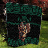 Green Christmas quilt with Krampus barrel centerpiece and textured quilt stitching