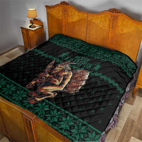 Green Christmas quilt laid on bed with Krampus barrel centerpiece and border trim