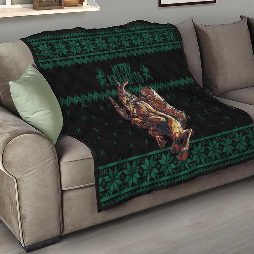 Green and black Krampus Christmas quilt on gray sofa with decorative border