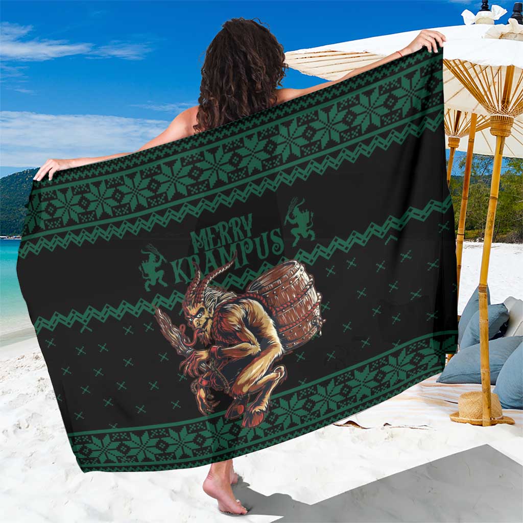 Green Christmas sarong with patterned bands and Krampus graphic, fringeless woven fabric