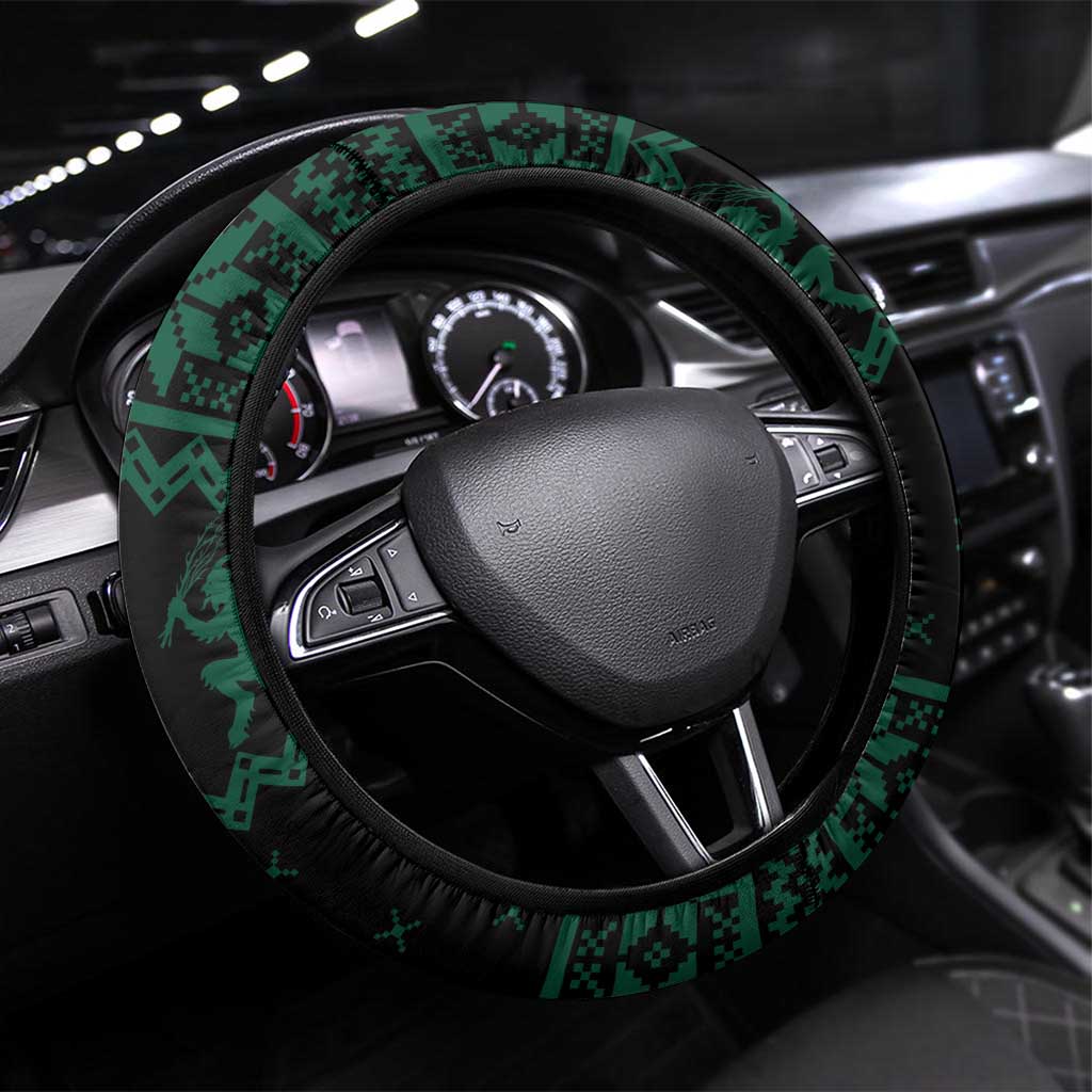 Green steering wheel cover with dark trim and festive patterned border, fitted on wheel