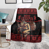 Krampus Christmas blanket draped over chair, black base with red Nordic pattern and “Merry Krampus”
