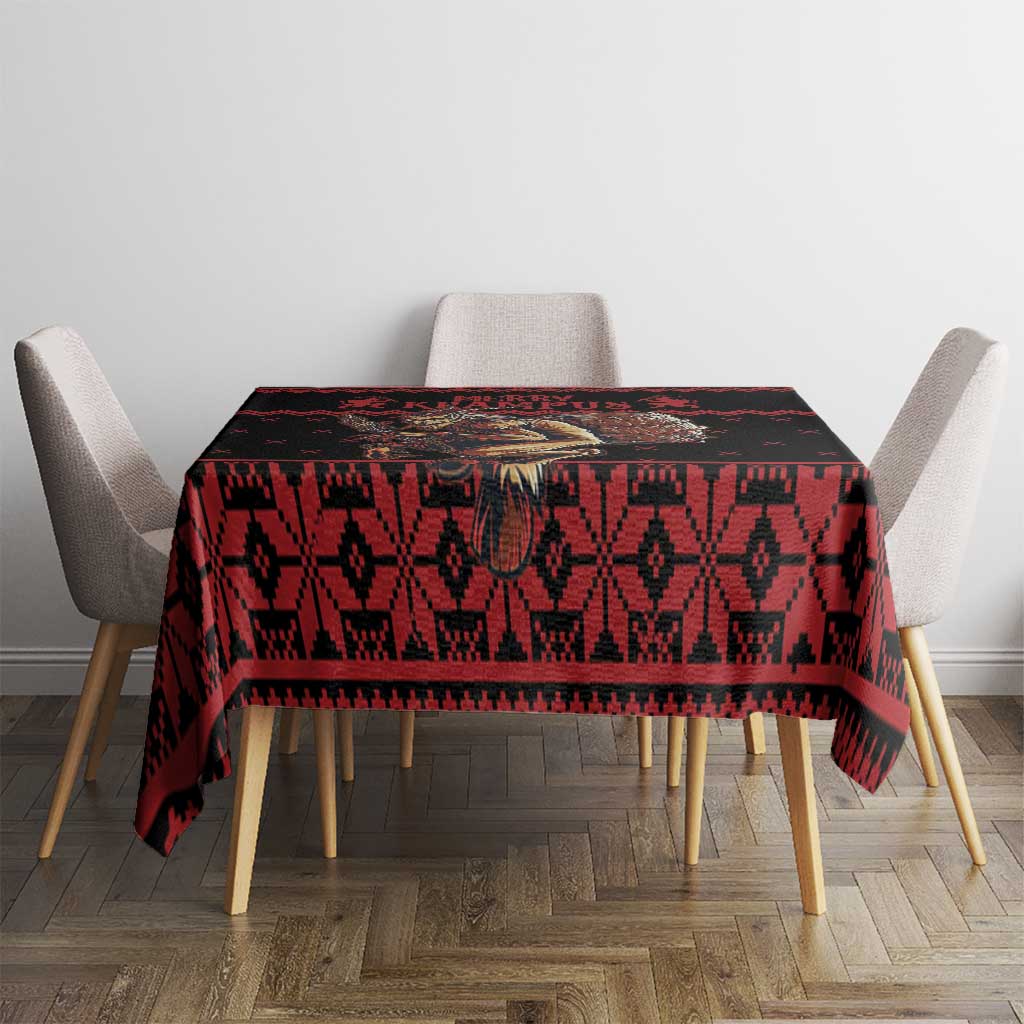 Red and black holiday tablecloth with bold repeating pattern on dining table