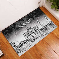 Personalized rubber doormat with black-and-white Brandenburg Gate scene and custom text