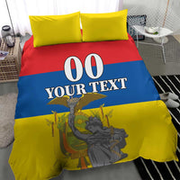 Bedding set with yellow pillows and flag-style red, blue, and yellow comforter; "00 YOUR TEXT".