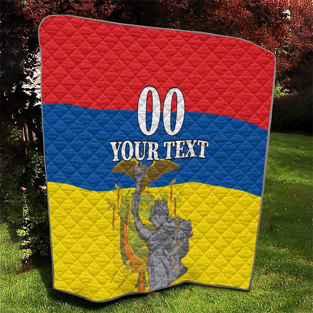 Red, blue, and yellow quilt with “00 YOUR TEXT” and Ecuador independence monument graphic.