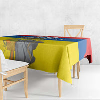 Rectangular tablecloth draped over dining table, featuring Ecuador flag colors