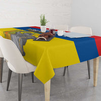 Rectangular tablecloth with Ecuador flag colors and monument print, dining table view