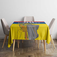 Rectangular tablecloth with Ecuador flag colors and monument graphic on dining table
