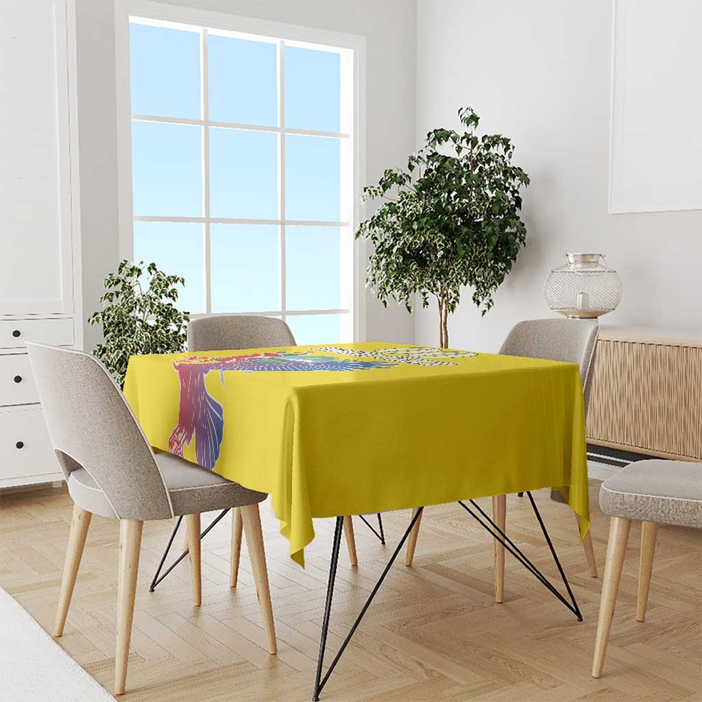 Yellow tablecloth over a dining table with condor and coat of arms print