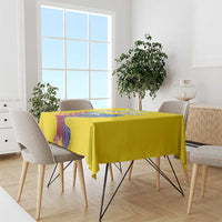 Yellow tablecloth over a dining table with condor and coat of arms print