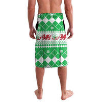 Green and white tartan-style lavalava with Cymru crest and decorative border trim