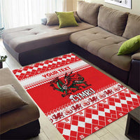 Red Christmas area rug with Welsh dragon center and checkered CYMRU border