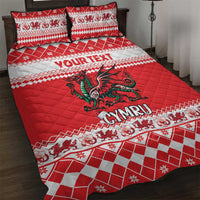 Red quilt bed set with green dragon and white patterned border on quilt and pillows
