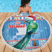 Blue round Christmas beach blanket with green bird and red Santa hat, tassel fringe, Feliz Navidad