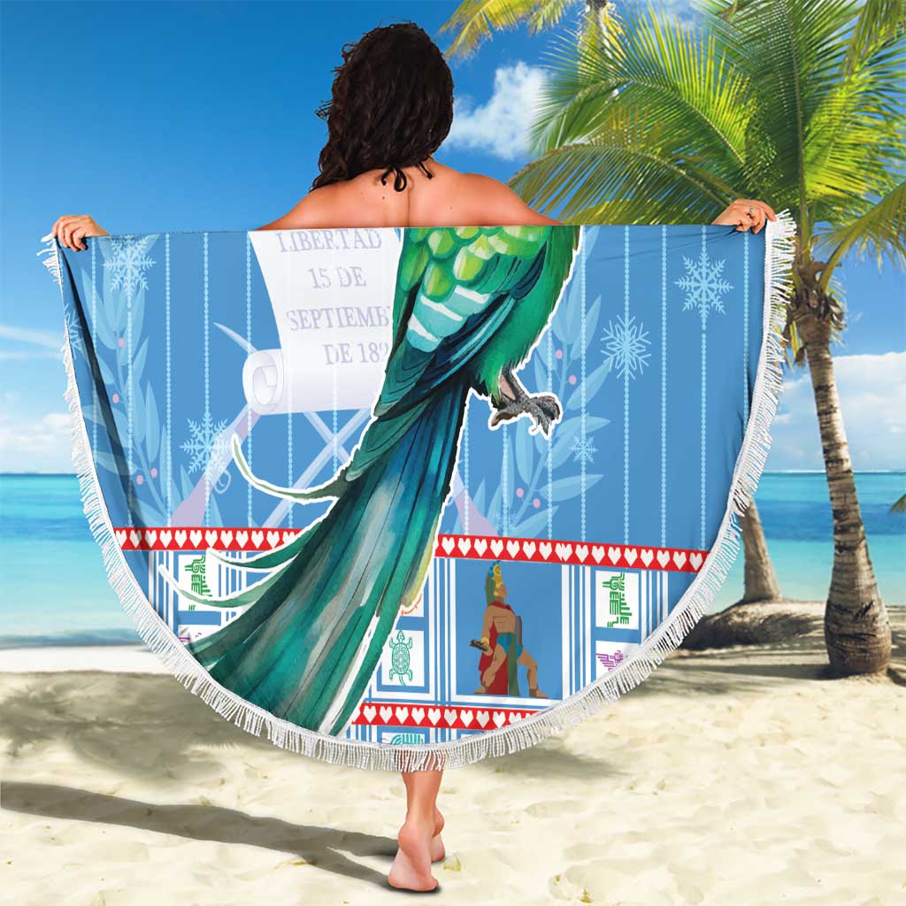 Blue round Christmas beach blanket with green bird and red Santa hat, fringed edge