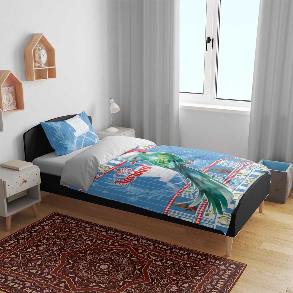 Blue Christmas bedding set on bed: duvet with parrot in Santa hat, coordinating pillows