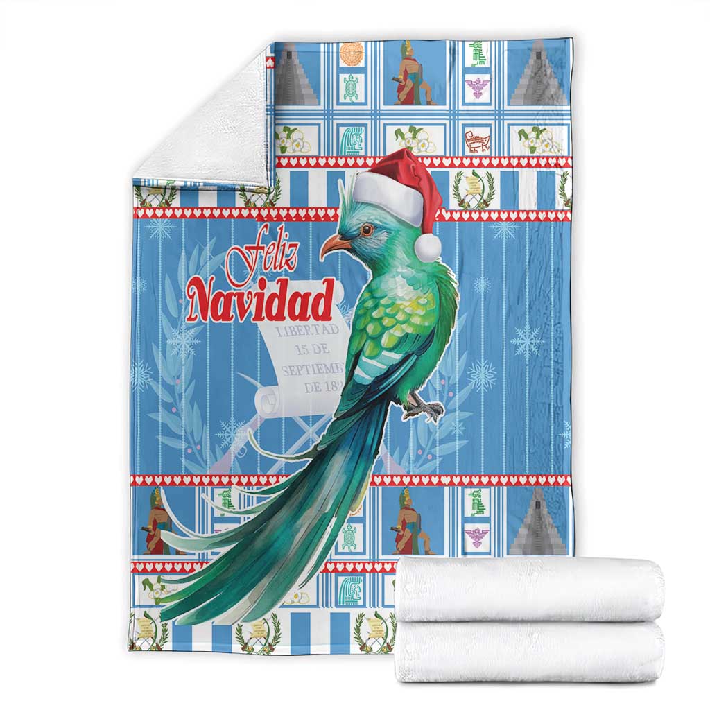 Folded blue Christmas blanket set with green bird and Santa hat, Feliz Navidad