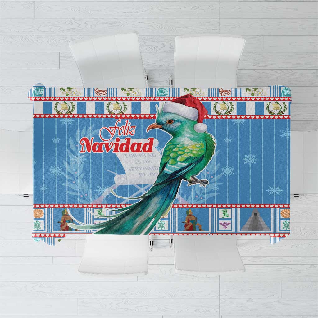 Blue Christmas tablecloth featuring “Feliz Navidad” text and a green bird illustration