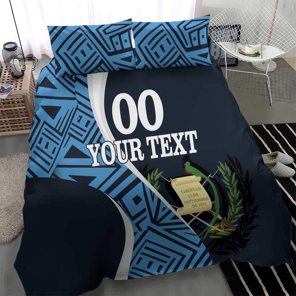 Navy football duvet with blue geometric graphics and '00 YOUR TEXT', showing two matching pillowcases