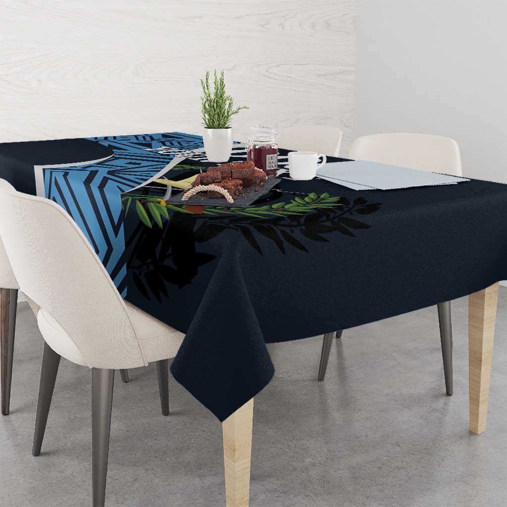 Custom football tablecloth draped over dining table: dark navy with blue geometric and leaf print
