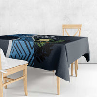 Custom tablecloth corner view in dark navy with blue geometric pattern and green leaf accents