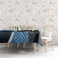 Custom football tablecloth on long table: dark navy with blue geometric print and greenery accents