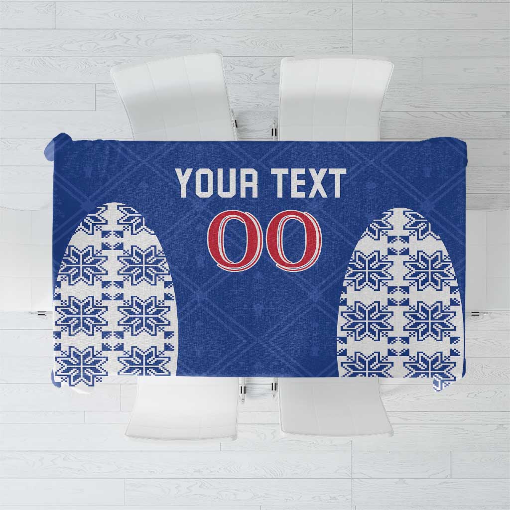 Blue tablecloth with white folk pattern, '00' and 'YOUR TEXT' print
