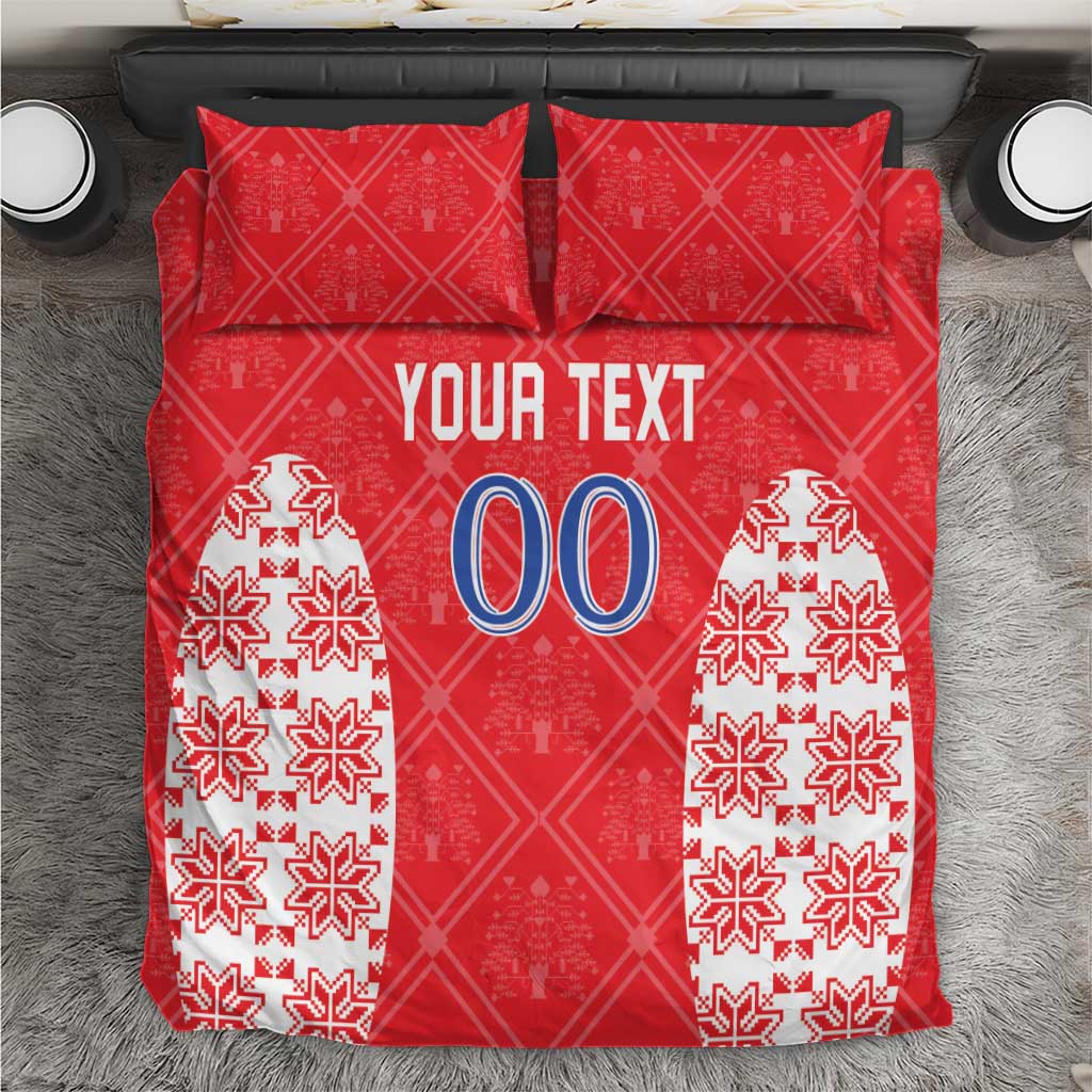 Red custom text bed linen set with two patterned pillowcases and duvet cover, snowflake motifs