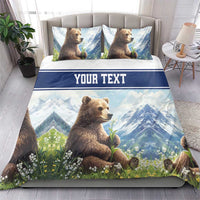 Blue duvet and pillowcase bedding set with brown bear artwork, mountain scene, and “YOUR TEXT” strip.