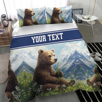 Blue bedding set with brown bear in wildflowers and mountains, featuring a “YOUR TEXT” banner.