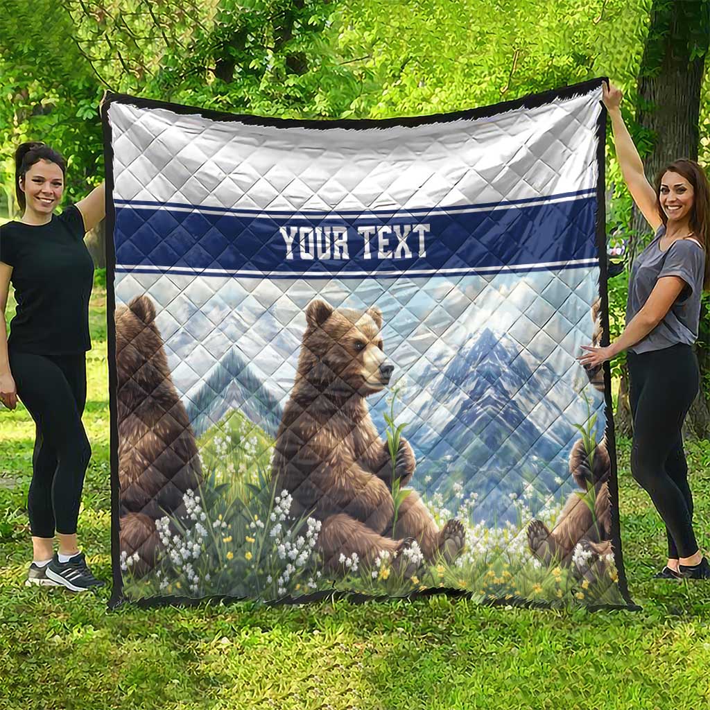 Quilt blanket featuring two bear cubs, blue stripes, and 'YOUR TEXT' text