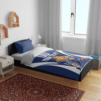 Blue and white hockey bedding set on bed with lion goalie, “YOUR TEXT,” and “00”