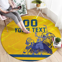Yellow round hockey area rug with blue 'YOUR TEXT' and two player illustrations