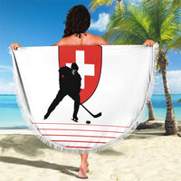 White round beach blanket with red hockey shield graphic and fringe trim