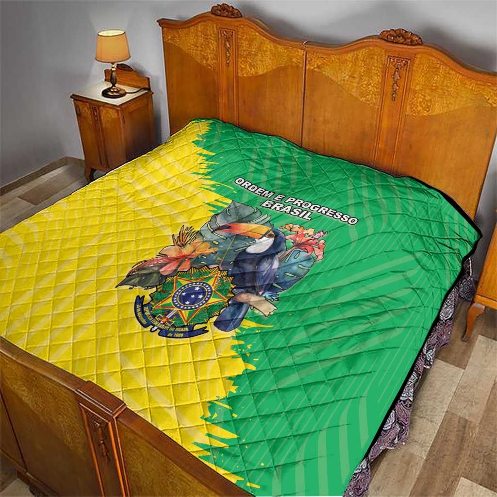 Brazil flag quilt on bed, green and yellow panels with quilt stitching, bird crest and “ORDEM E PROGRESSO BRASIL”