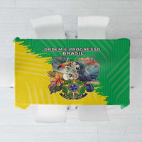 Green and yellow Brazil flag-style tablecloth with coat of arms crest in center