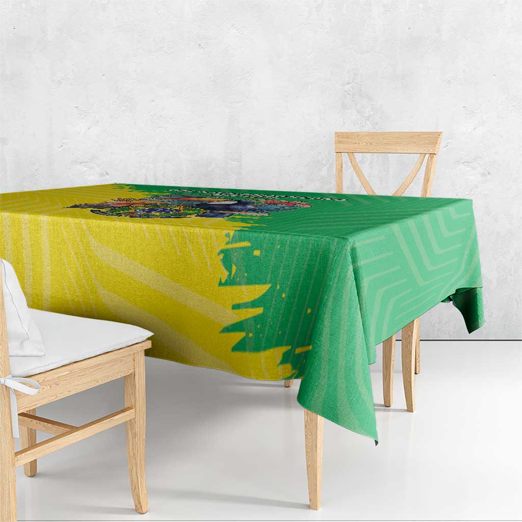 Brazil flag-style tablecloth, green and yellow, draped over dining table