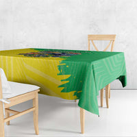 Brazil flag-style tablecloth, green and yellow, draped over dining table