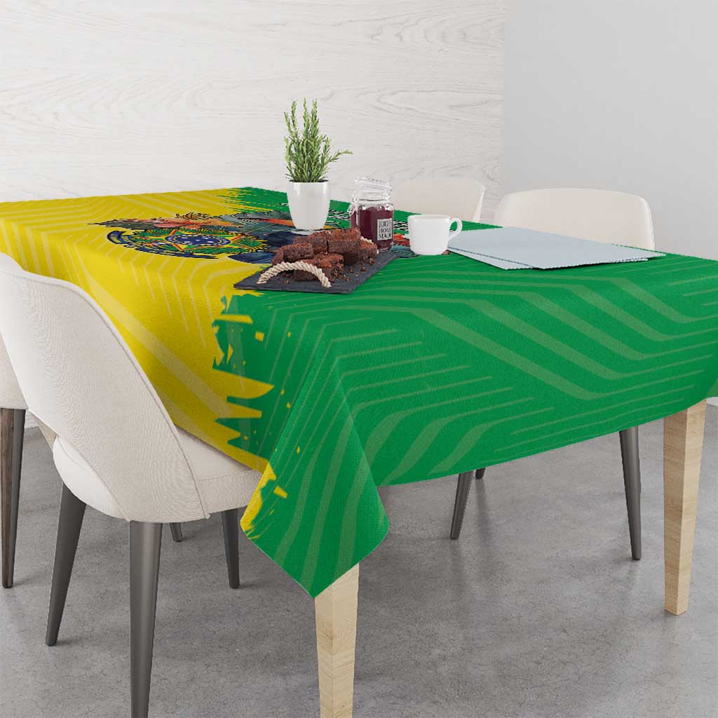 Green and yellow Brazil flag-style tablecloth with crest design on dining table
