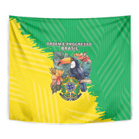 Close-up Brazil flag-style coat of arms tapestry, green-yellow cloth with crest bird emblem.