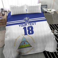 Football bedding set: white duvet with blue yoke stripe, number 18, and two diamond pillows
