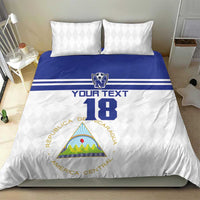Football bedding set with white duvet, blue band across top, number 18 and two white pillows