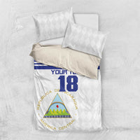 Football bedding set with white duvet and two pillows, blue band and number 18 on front
