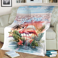 Tropical flamingo throw blanket with custom text, laid on cream armchair
