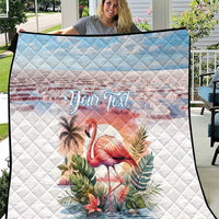 White quilt with diamond pattern, pink flamingo artwork, tropical foliage, "Your Text" across center.