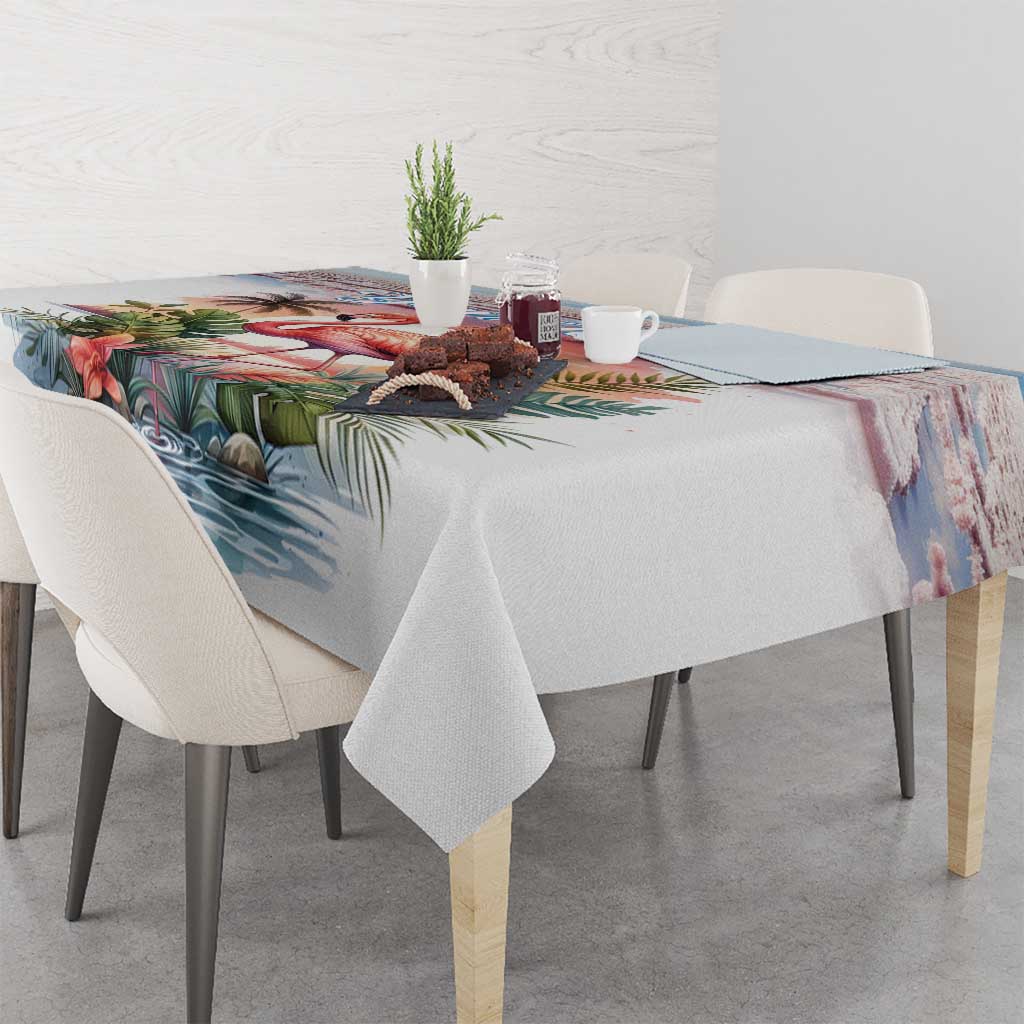 Tropical flamingo tablecloth with palm leaves covering dining table with centerpiece