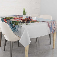 Tropical flamingo tablecloth with palm leaves covering dining table with centerpiece